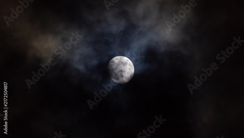 Fotografie Full moon in the night sky with clouds