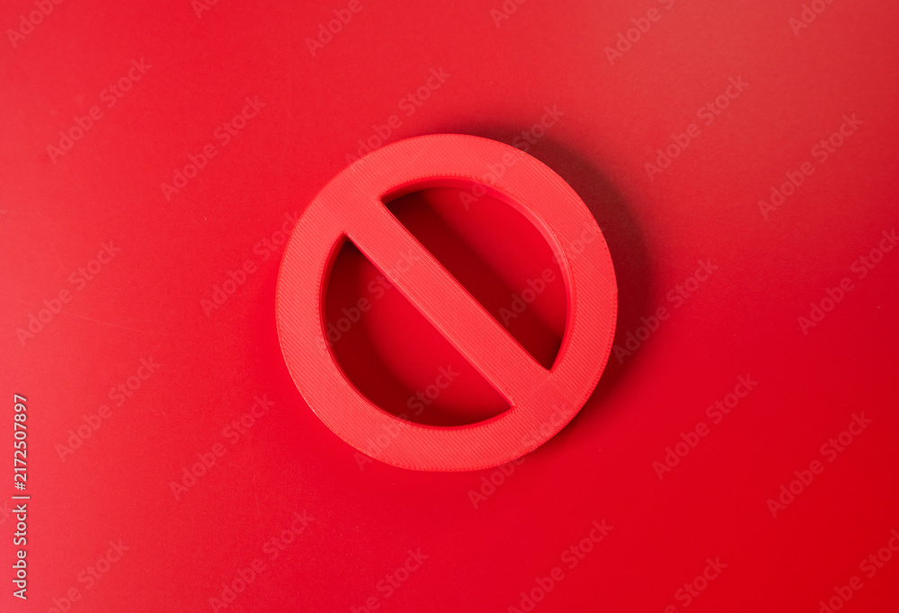Obraz premium Prohibition symbol on a red background. Sanctions and restrictions concept. Cancellation, refusal and a total ban represent blocked access and strict limitations.