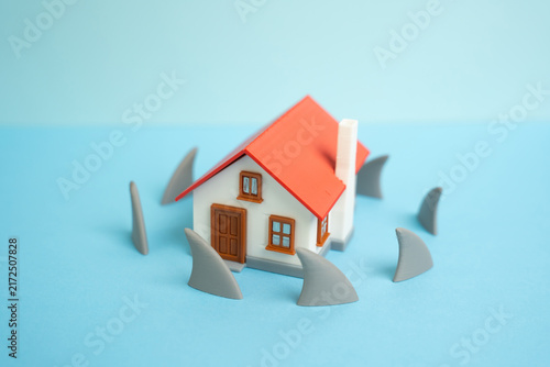 Obraz na płótnie Residential house surrounded by shark fins