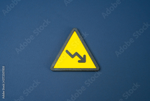 Cuadro en lienzo Falling symbol with a downward arrow