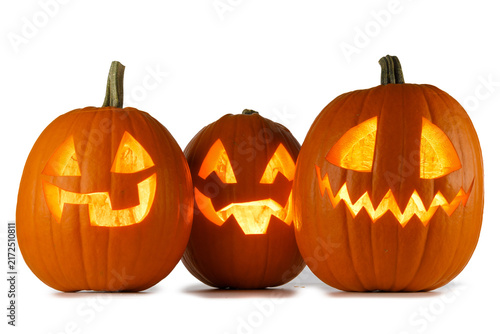 A carved Halloween pumpkin with glowing face