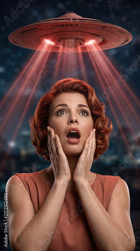 Shocked vintage woman in retro style looking up at a flying saucer UFO spaceship
