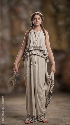 Ancient Greek goddess Demeter holding wheat in traditional tunic