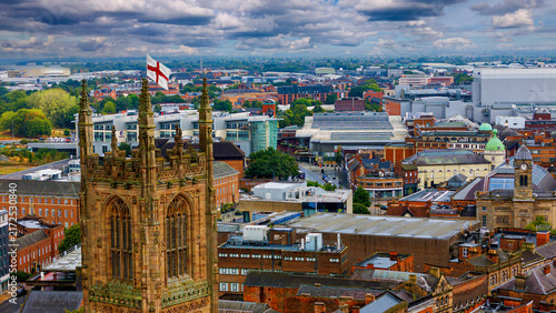 Fotografie English flag atop cathedral tower over Derby urban panorama