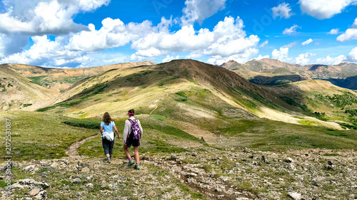 Hikers walk along the Continental Divide at 12,500 feet near Colorado's Loveland Pass