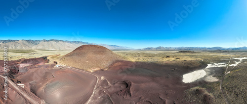 A UAV Drone view of the Fossil Falls Cinder Cone Red Hill Area on US 395 in the Owens Valley left over from vulcanism that built the Sierra Nevada mountain Range looking at the Fossil Falls Obsidian 