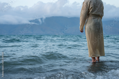 Fotografía Jesus walks on water, divine miracle, biblical scene.