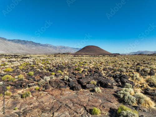 A UAV Drone view of the Fossil Falls Cinder Cone Red Hill Area on US 395 in the Owens Valley left over from vulcanism that built the Sierra Nevada mountain Range looking at the Red Hill Cinder Cone 