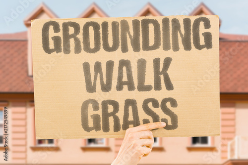Obraz na płótnie "Grounding walk grass" Walking barefoot reduces inflammation