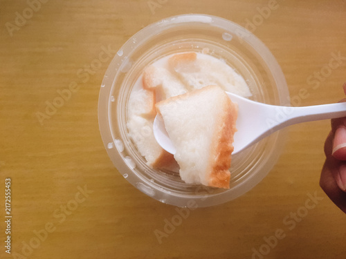 Cuadro en lienzo Warm bread and fermented cassava drink with coconut milk