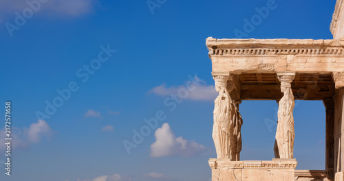 View with blue sky and Korai of the Ancient Erechtheion Temple on Athens Acropolis