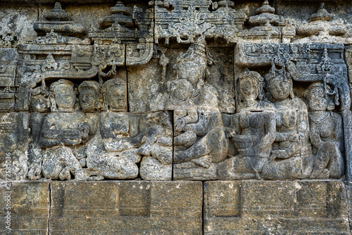 Obraz na płótnie Borobudur stone relief carving depicting buddhist figures