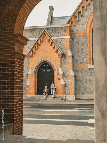 Photography Couple resting on church steps at Union Church, Shanghai