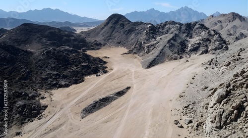 High angle view of winding dry riverbed through mountains

