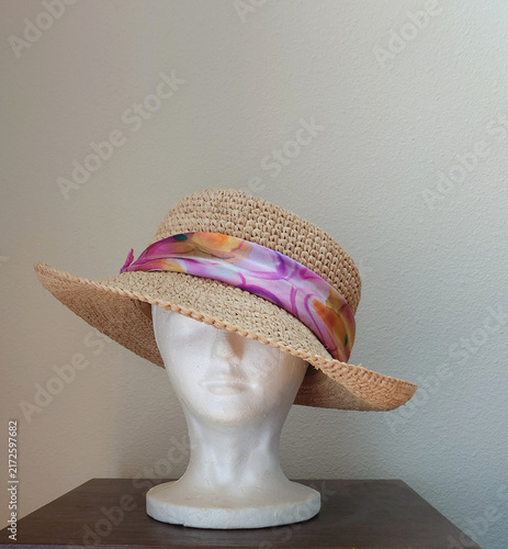 straw hat with floral silk-like hatband