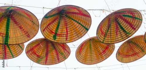 Colorful Traditional Vietnamese Woven Hats Hanging Overhead