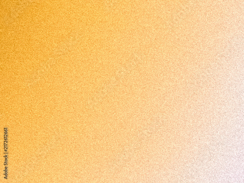 Abstract background texture with fine noisy grain and a soft gradient transition from vibrant yellow to warm orange and white. 