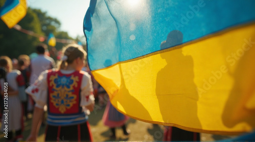 Colorful Ukrainian Flag Banner Near Traditional Dressed People in Outdoor Festival