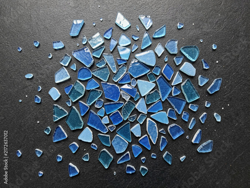 background from blue glass with a broken glass.
