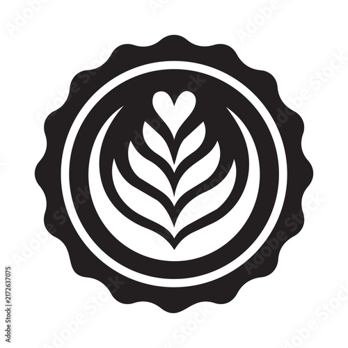 A round black emblem showcasing elegant white latte art featuring a heart and leaf pattern