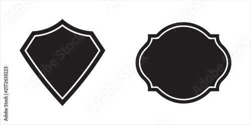 Two black shield and ornate oval shapes with white outlines on a clean white background