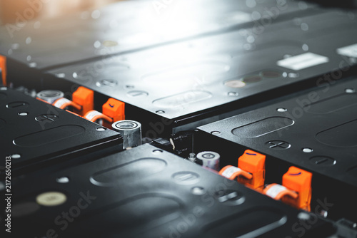 Close Up EV Lithium Battery System in Automotive Diagnostic Workshop.  Electric Car Power Storage Cells Under Maintenance and Inspection