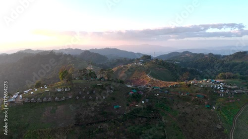 4k Aerial video of a village in a beautiful valley and forest.	
