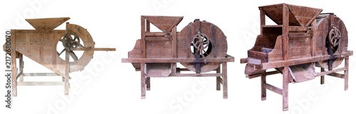 Foto Three antique wooden threshing machines or grain separators isolated on a white