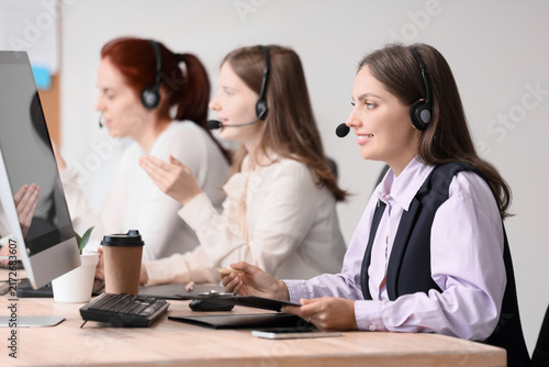 Customer support and call center service, diverse team of operators working o...