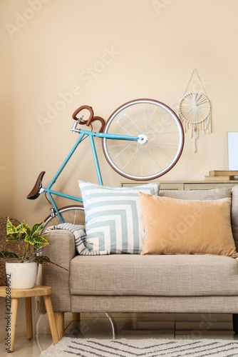 Quadro su tela Interior design and home comfort cozy living room with modern sofa decorative bi