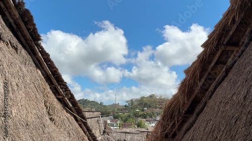 Scenic Mountain Landscape Viewed Between Traditional Village Houses

