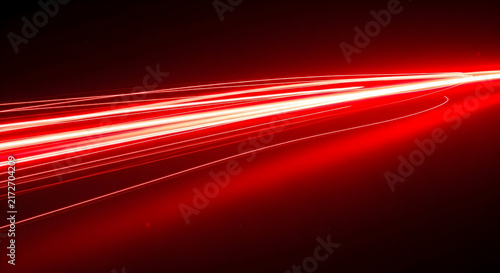 Abstract Light Trail Image Featuring Red Streaks Creating Dramatic Atmosphere With Dynamic Movement In Night Photography