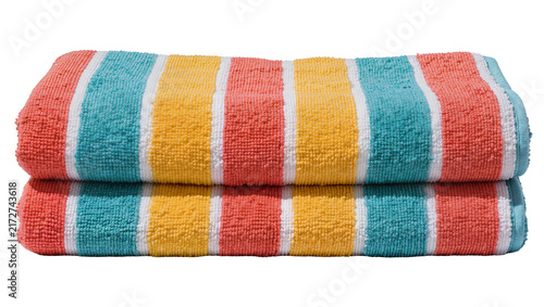 Two folded striped beach towels in coral yellow and teal, isolated on transparent background
