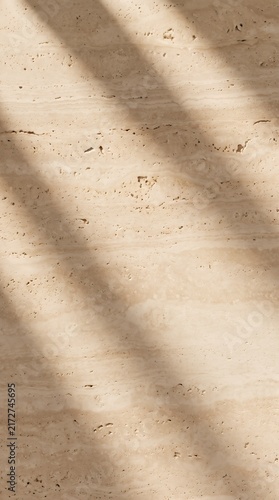 Sculptural Travertine Stone with Dramatic Light and Shadow Vertical Background