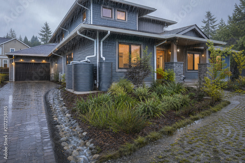 Modern Stormwater Resilient Suburban Home Collecting Heavy Rain Through Oversized Gutters, Dual Storage Tanks, Permeable Paving, Bioswales, and Rain Gardens