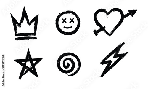 Set of handdrawn grunge doodle icons including a crown, smiley face, heart with arrow, star, spiral, and lightning bolt