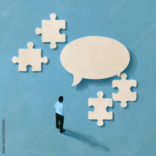 People discussing ideas with puzzle pieces and a speech bubble in a creative concept