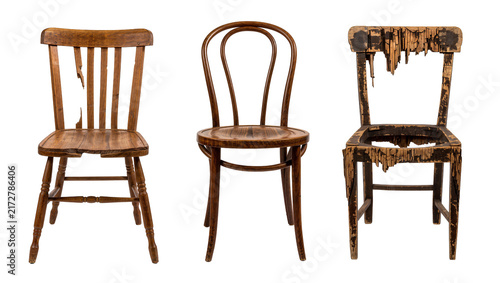 Canvas Print Three antique wooden chairs in varying states of disrepair, isolated on transpar