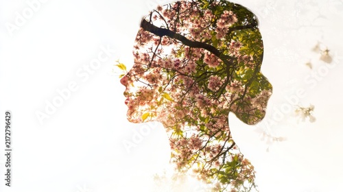Nature's Embrace: A woman's profile seamlessly blends with a blossoming cherry tree, symbolizing growth, renewal, and the interconnectedness of life.