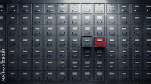 Organized storage drawers with one highlighted red compartment for data management