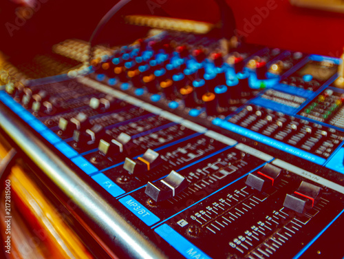 Canvastavla Colorful Audio Mixing Console Knobs Close Up with Vibrant Blue Red Bokeh Lightin