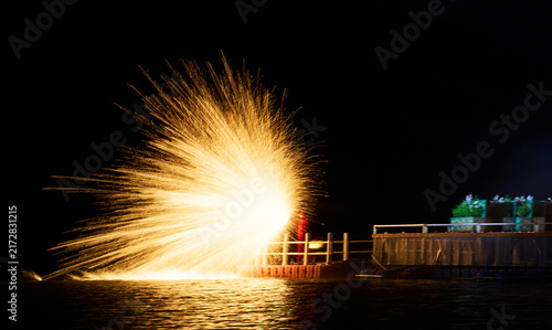 Golden sparks flew as the intangible cultural heritage of iron-making was displayed on the lakeside.
