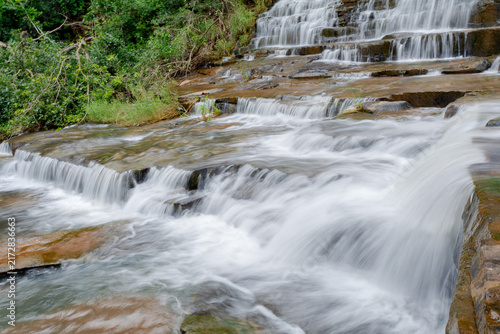 A magnificent sight of the milky waterfall cascaded down over the rocky hill. Teerathgarh Falls, Chhattisgarh, India