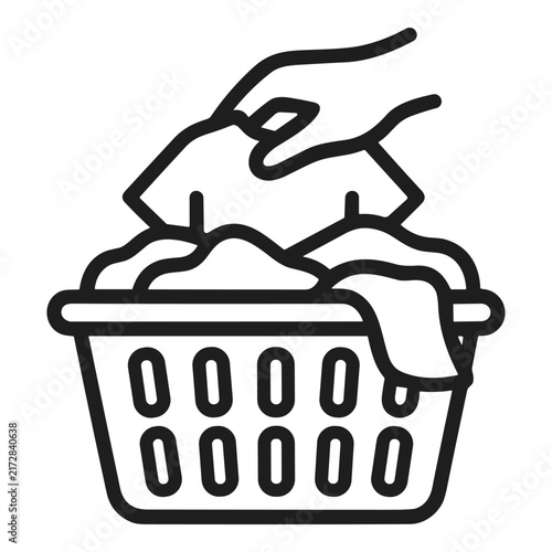 Hand putting clothes into laundry basket vector line icon