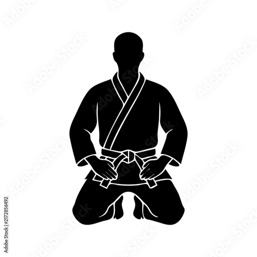 Kneeling Martial Artist Silhouette in Karate Gi Kimono Uniform
