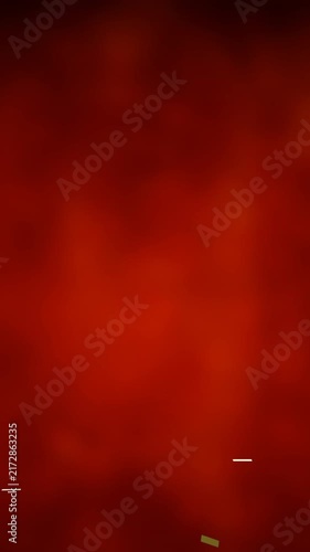 Animation of golden confetti falling over glowing red background