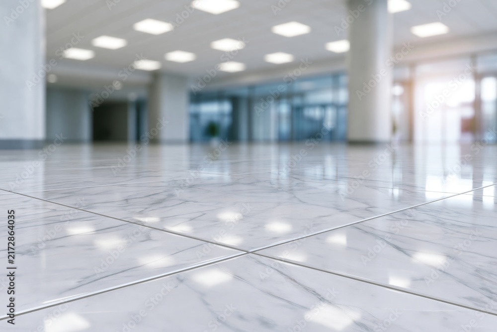 Naklejka premium The Marble Floor Lobby in Bright Modern Atrium with Reflective Tiles