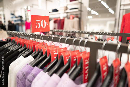Obraz na płótnie Half price discount sign at a major clothing store sale