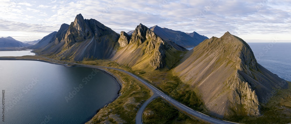 Naklejka premium The Mountain Road Along the Rugged Coastal Ridge Overlooking the Sea