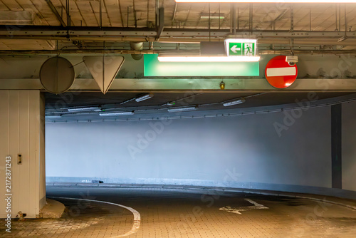 Canvastavla Underground parking entrance driveway with no entry road sign, illuminated emerg